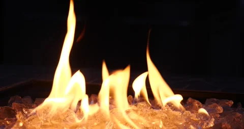 Flames dancing over ice in an outdoor fire pit Stock Footage 281815970