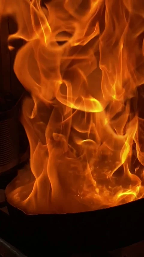 Flames dancing over the wok Stock Footage 341876067