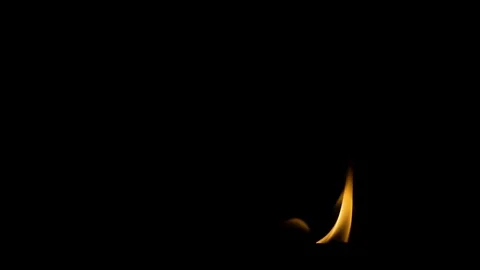 Flames in the dark moving left and right Stock Footage