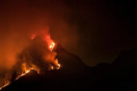 Flames devastate the Moregallo peak above Como lake, tragedy in Lombardy Stock Photos