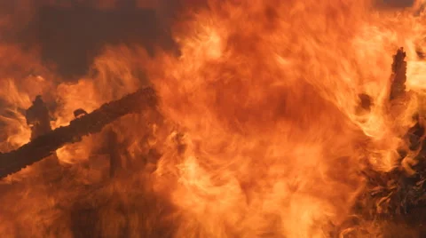 Flames devour the last charred rubble of a house destroyed by fire Stock Footage 59221700