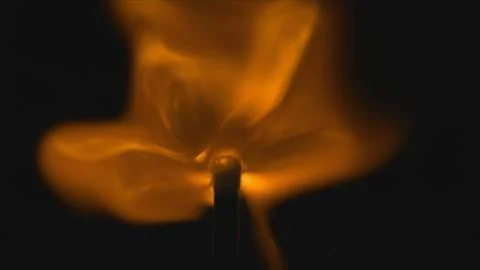 Flames emerging from match head closeup Foto stock