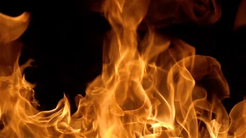 Flames of fire on black background in slow motion Stock Footage