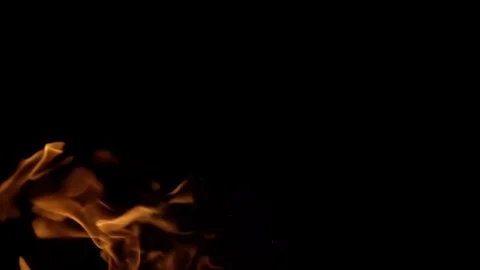 Flames of fire on black background in slow motion Stock Footage