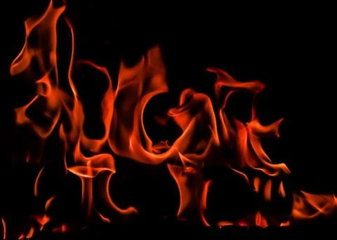 Flames of fire on a black background. Space for copy, text, your words Stock Photos