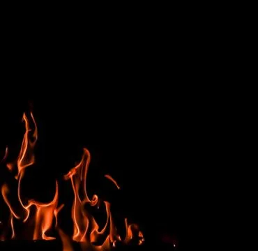 Flames of fire on a black background. Space for copy, text, your words Stock Photos