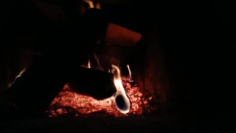 Flames of fire from bottom to top in the fireplace at night Stock Footage 168768213