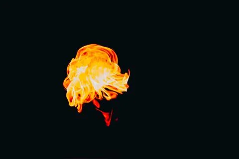 Flames of fire on dark background Stock Photos