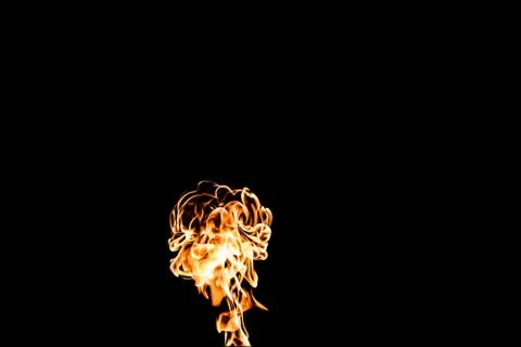 Flames of fire on dark background Stock Photos