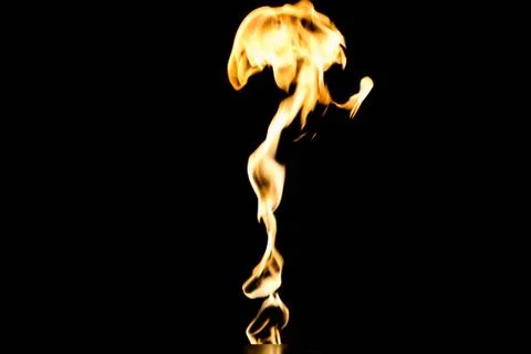 Flames of fire on dark background Stock Photos