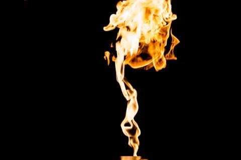 Flames of fire on dark background Stock Photos