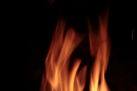 Flames of fire in a fireplace. Stock Photos