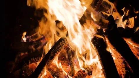Flames of fire place lit the bonfire night sparks smoldering logs and falling Stock Footage 72522214