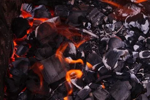 Flames of the fire. View from above. Hot coals and fire. Stock Photos