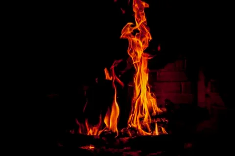 Flames in fireplace Stock Photos