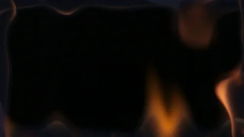 Flames frame the screen on a black background Video stock 84699275