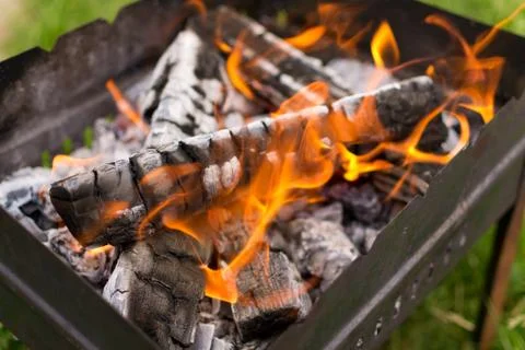 Flames in the grill Stock Photos