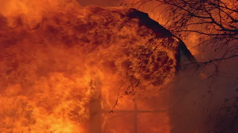 Flames of  house fire engulfing gable window Stock Footage 59240503