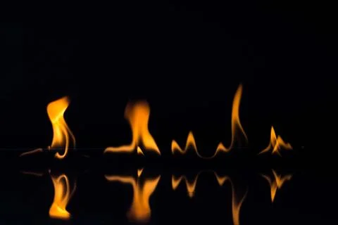 Flames isolated on black Stock Photos