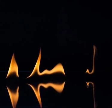 Flames isolated on black Stock Photos