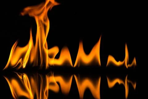 Flames isolated on black Stock Photos