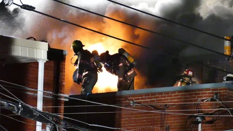 Flames at night with firefighters Video stock 115935015