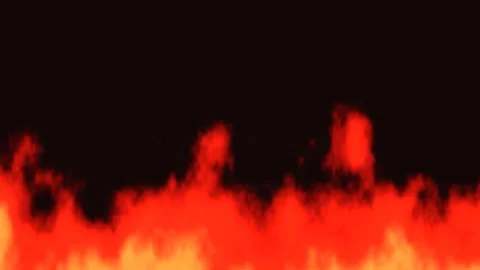 Flames rise and dance against a dark background, creating Stock Footage 338234791