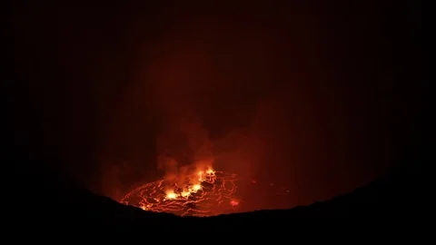 Flames rising from active volcano at night Stock Footage 103805469