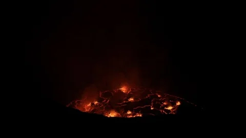 Flames rising from active volcano at night Stock Footage 103805711