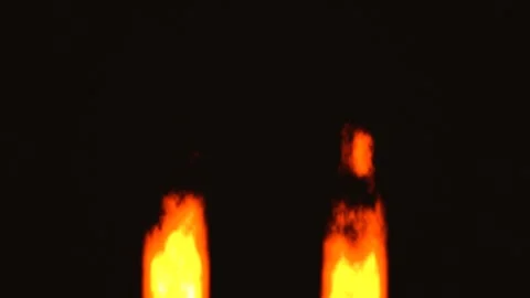 Flames rising against a dark background in slow motion Stock Footage 338191506