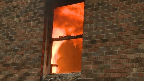 FLAMES SEEN THROUGH WINDOW Stock Footage 93402369