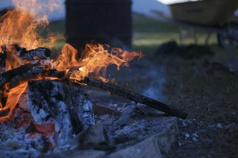 Flames spewing out of a fire pit. Stock Photos