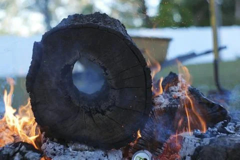 Flames spewing out of a fire pit. Stock Photos