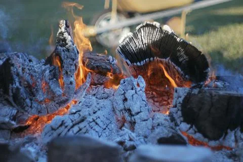 Flames spewing out of a fire pit. Stock Photos