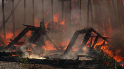 Flames still burning in collapsing rubble of  house fire Stock Footage 59242605