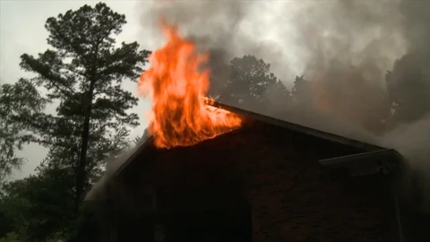 FLAMES THROUGH ATTIC Stock Footage 93402385