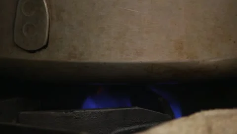 Flames under pan Stock Footage 10681408