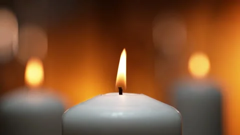 Flames of White Ceremonial Candles Dancing in a Tranquil Spa Atmosphere Stock Footage 271007696