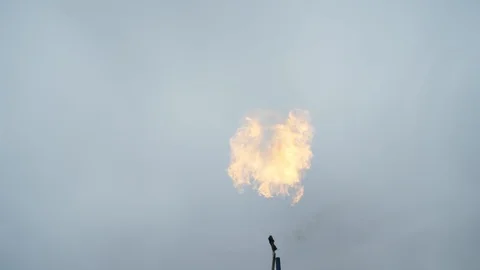 Flamethrower shooting fireballs into the air Stock Footage 114585084
