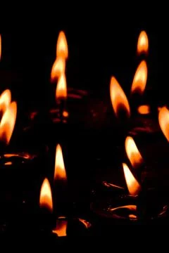 Flaming candles Stock Photos