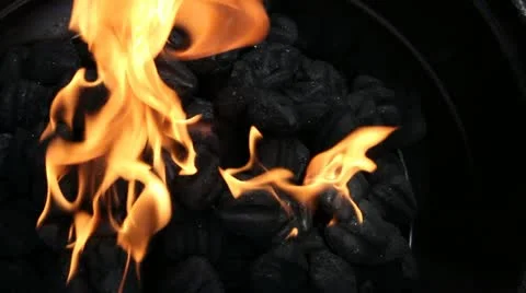 Flaming charcoal brickets Stock Footage 11399961
