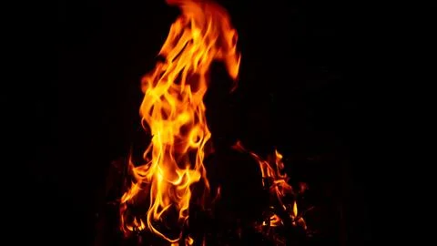 Flaming flames on a black background Stock Photos