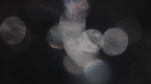 Flaming silver bokeh moving on a black background Video stock 317480016