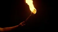 Flaming Torch Is Held Up In The Dark Stock Footage