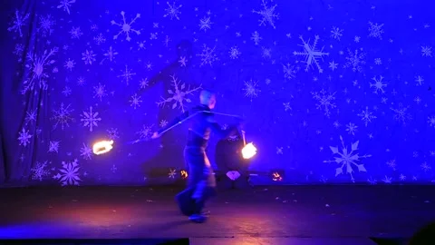 Flaming Tricks and Stunts: Male Fire Artists Wow Crowd with Rolling and Stock Footage 229685545