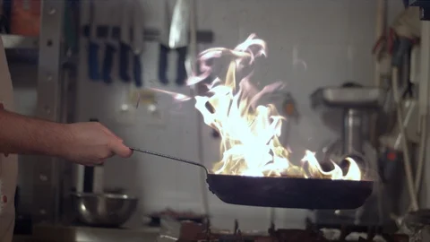 Flaming vegetables in a frying pan Stock Footage 86468184