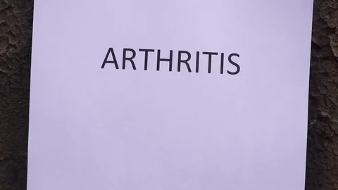 Flaming word arthritis 스톡 동영상 78010976