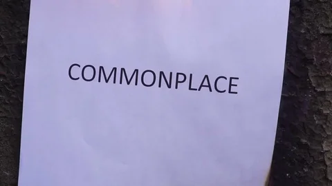 Flaming word commonplace slow motion Video stock 78080847