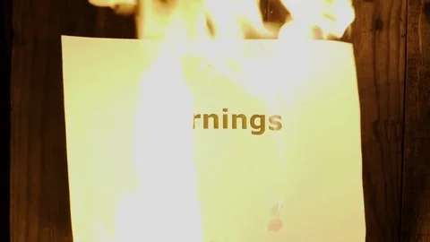 Flaming word Earnings Stock Footage 75548715
