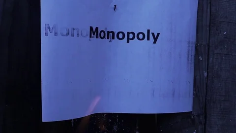Flaming word Monopoly Stock Footage 75911609